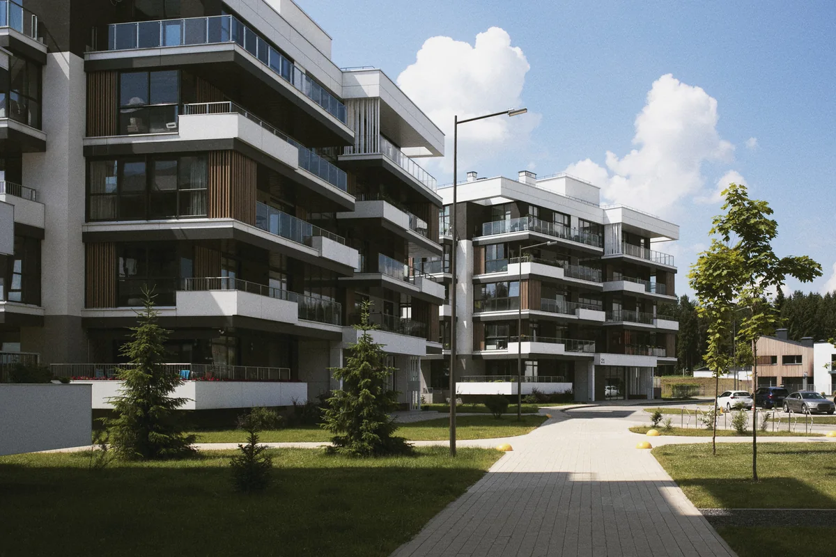 Immeubles résidentiels avec balcons et espaces verts, illustration de l’investissement dans les logements sociaux.